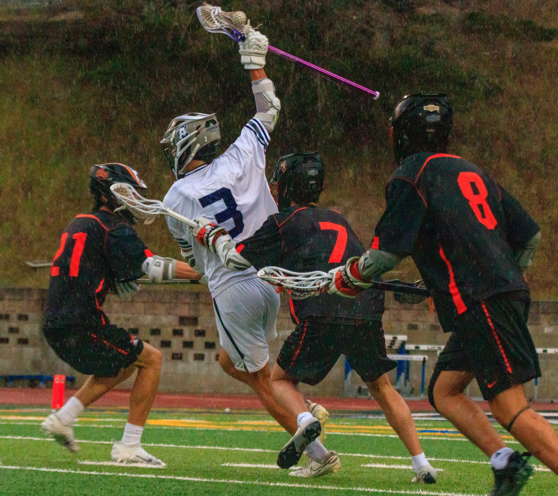 Alex Sandoval drives to the goal in the rain against Los Gatos defenders