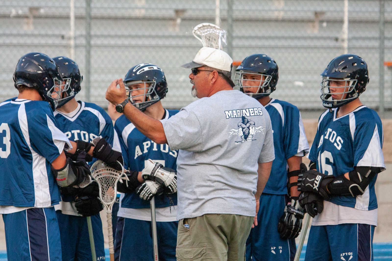Coach Paul Murtha addresses the Aptos Mariners during a game against Watsonville, April 2009