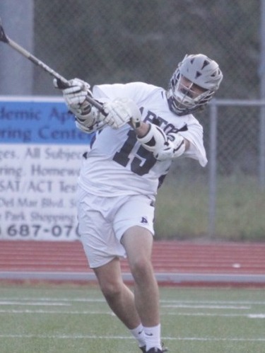 Will Patterson #15 shooting in Aptos Mariners white