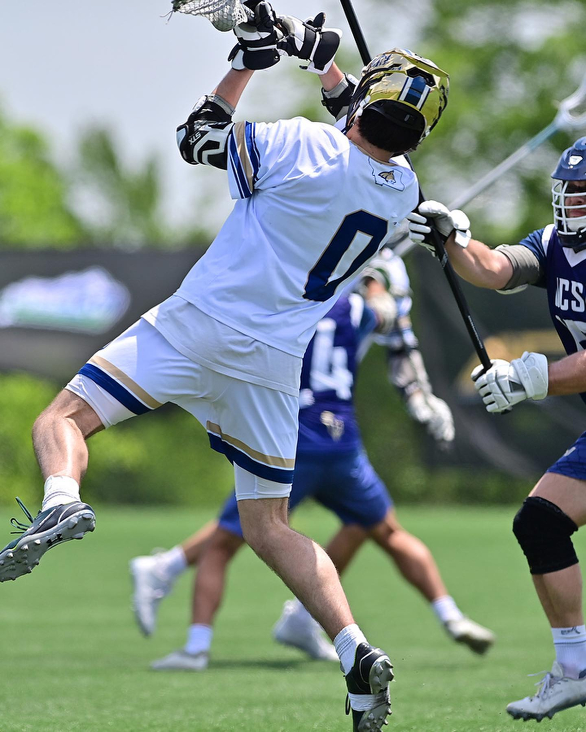 Will Patterson #0 shoots against a defender in MCLA action