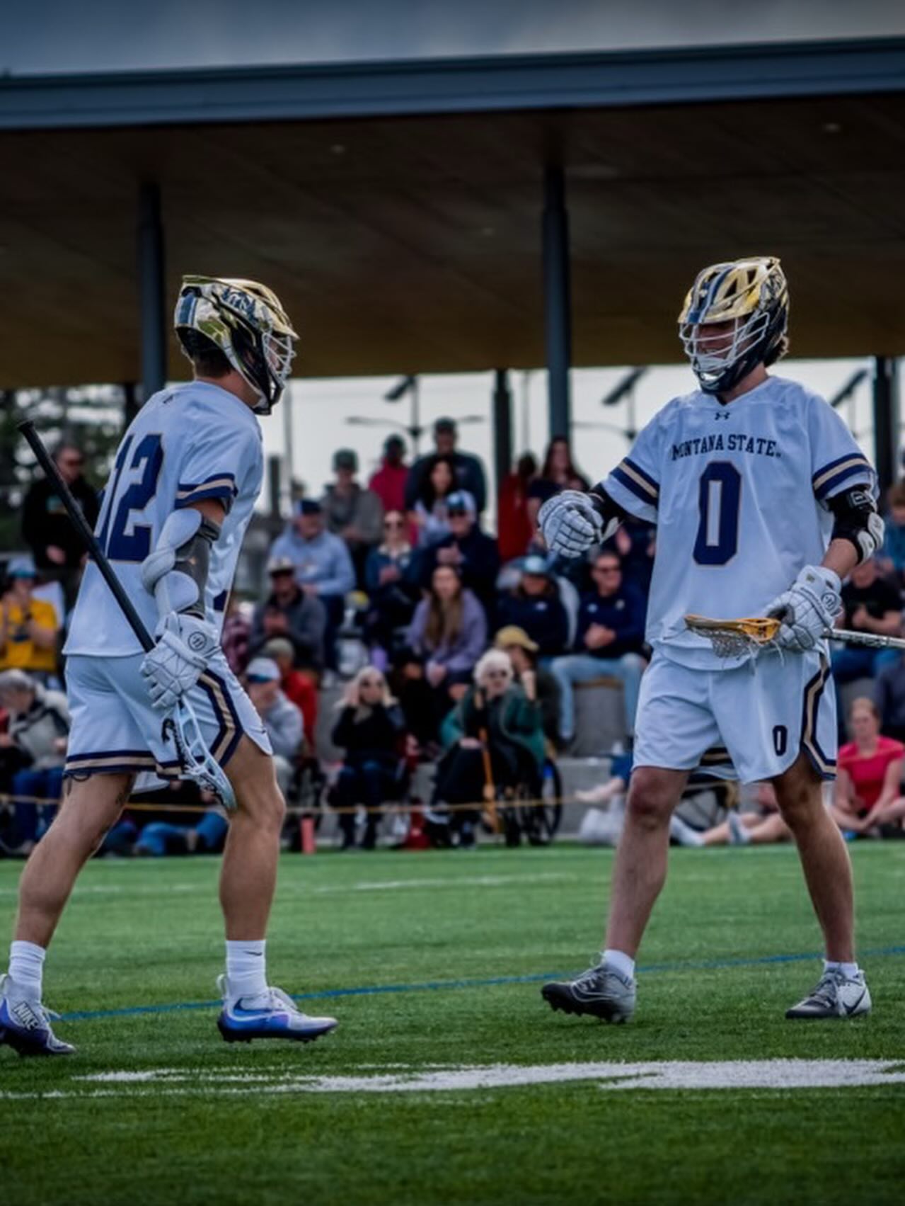 Will Patterson #0 with teammate on the field at Montana State