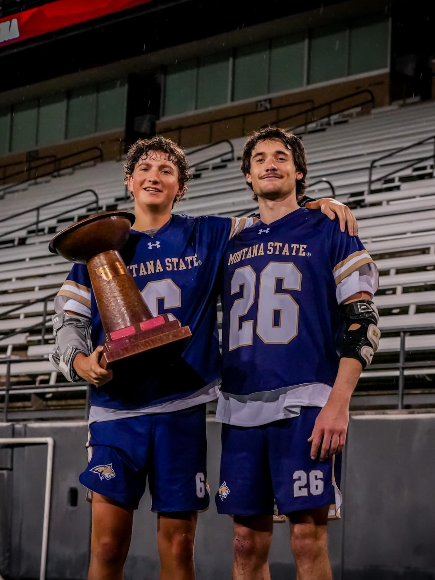 Will Patterson and teammate hold the RMLC championship trophy