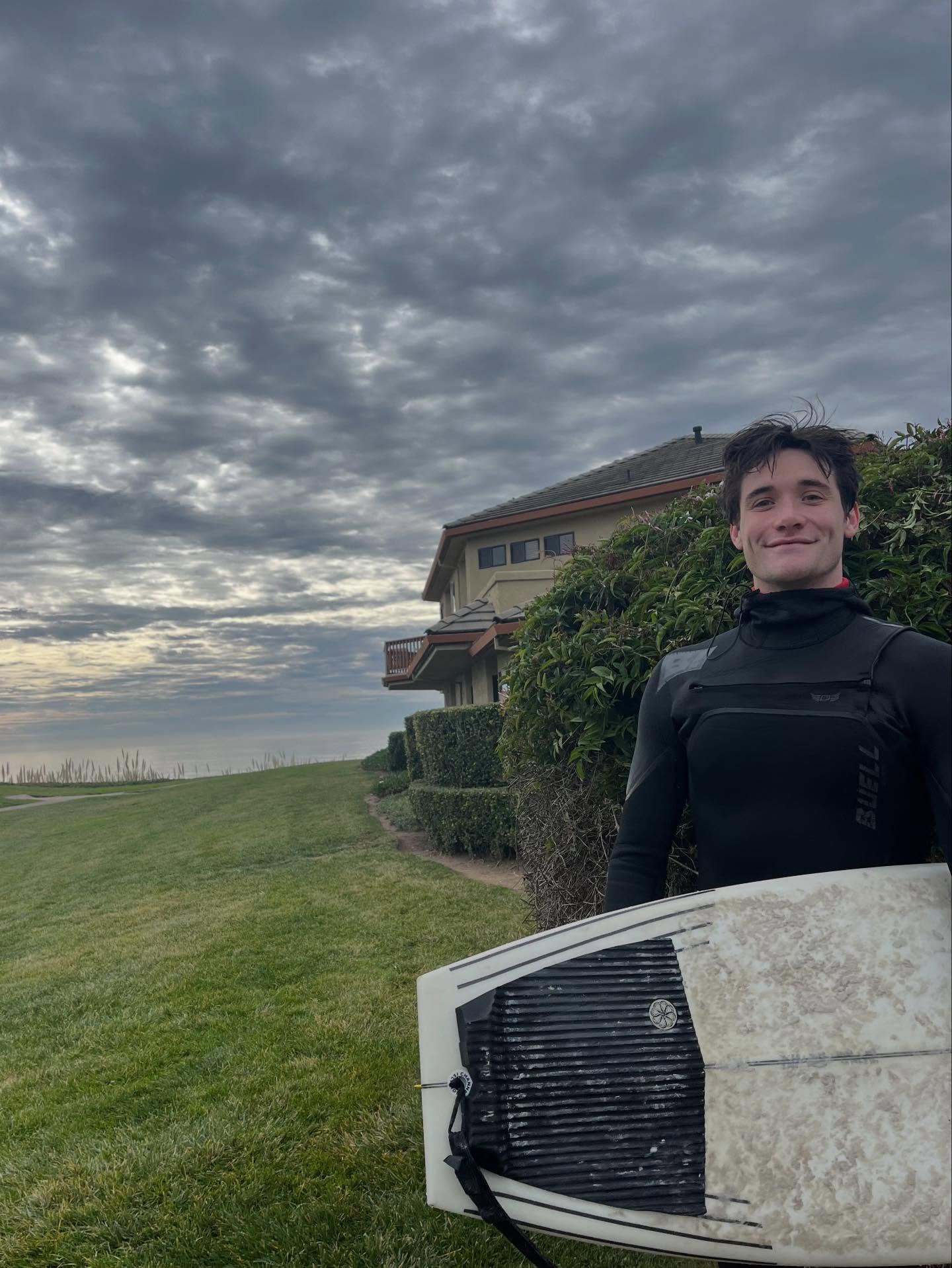 Will Patterson with surfboard on the California coast